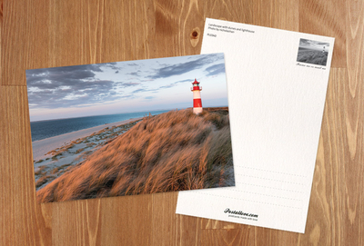Landscape with sand dunes and a lighthouse